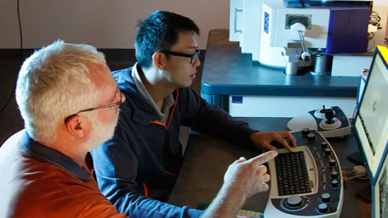 Two people using ZEISS UltraPlus microscope